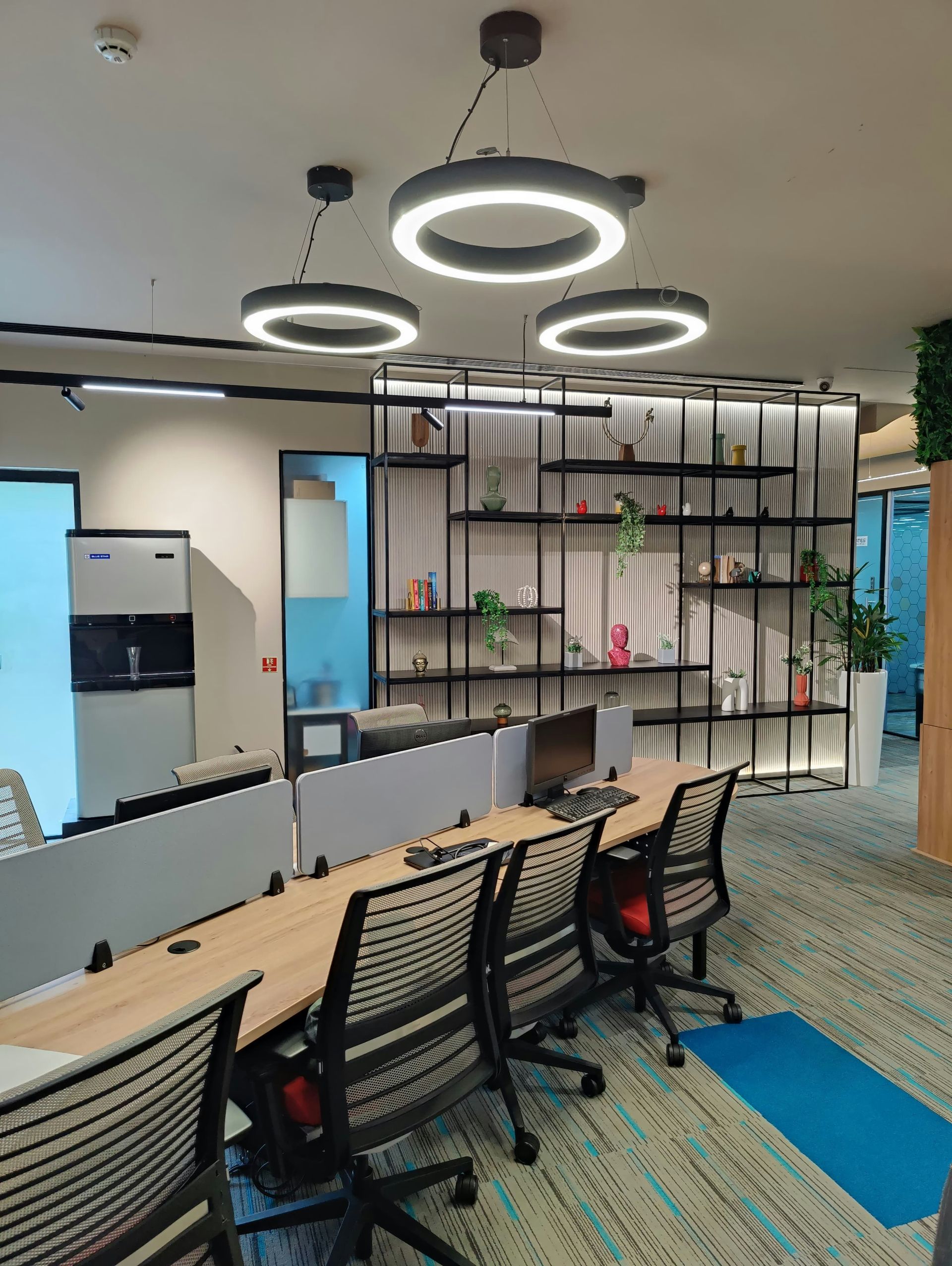 A conference room with a long table and chairs