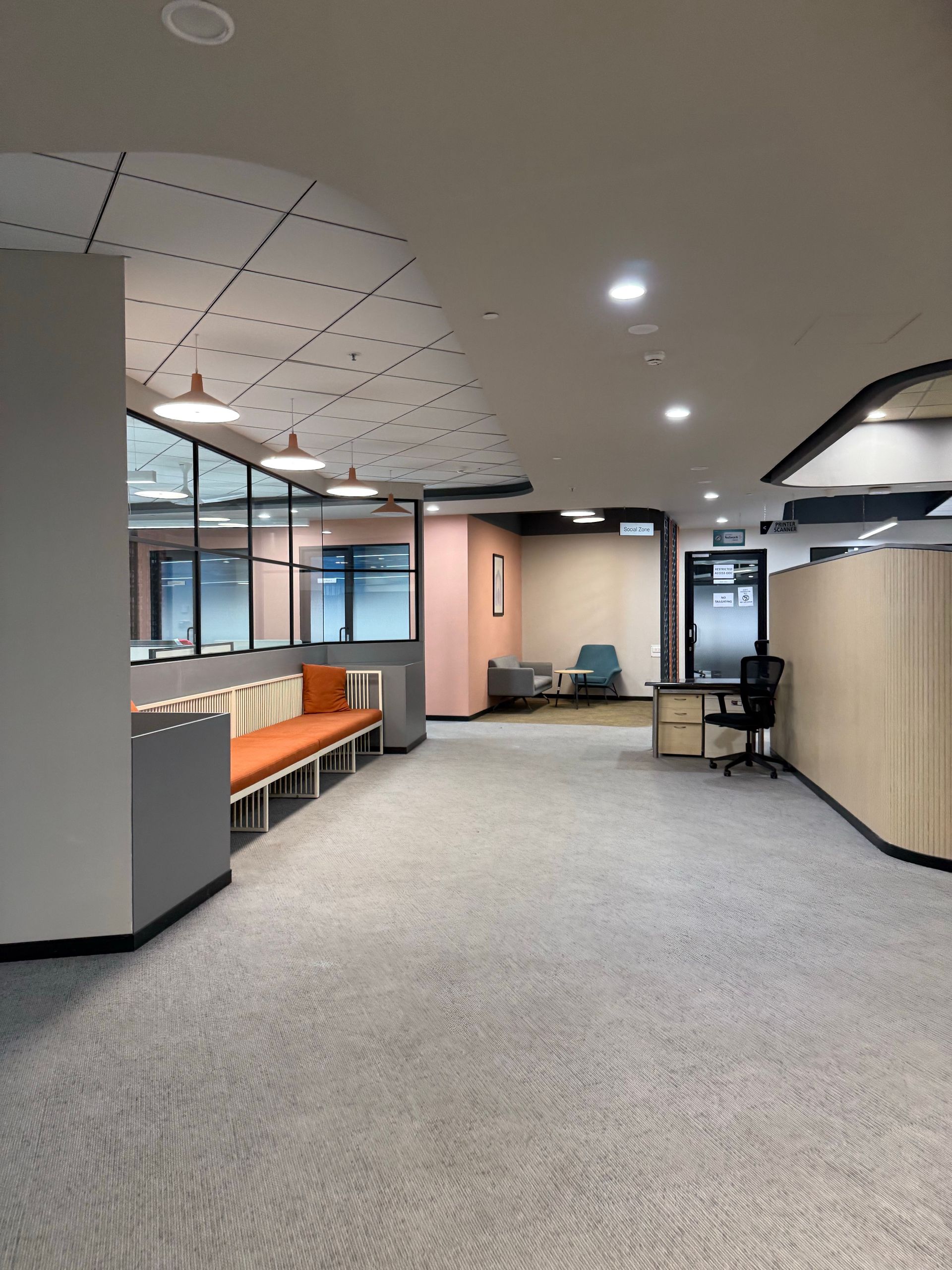 Spacious office interior with modern furnishings and neutral tones.